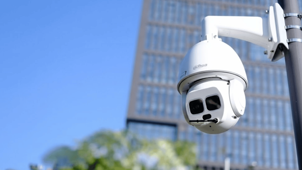 ptz ip surveillance camera mounted on a pole providing advanced monitoring and tracking in an urban outdoor environment