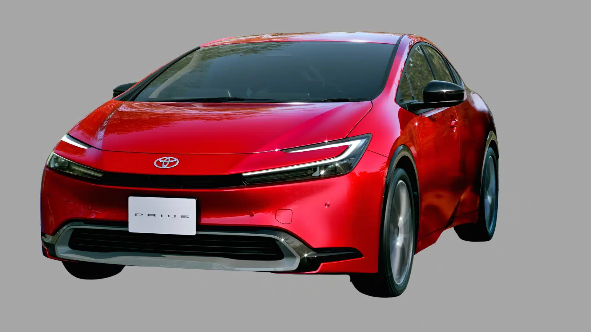 Red Toyota Prius shown in angled front view with sleek LED headlights on a plain gray background