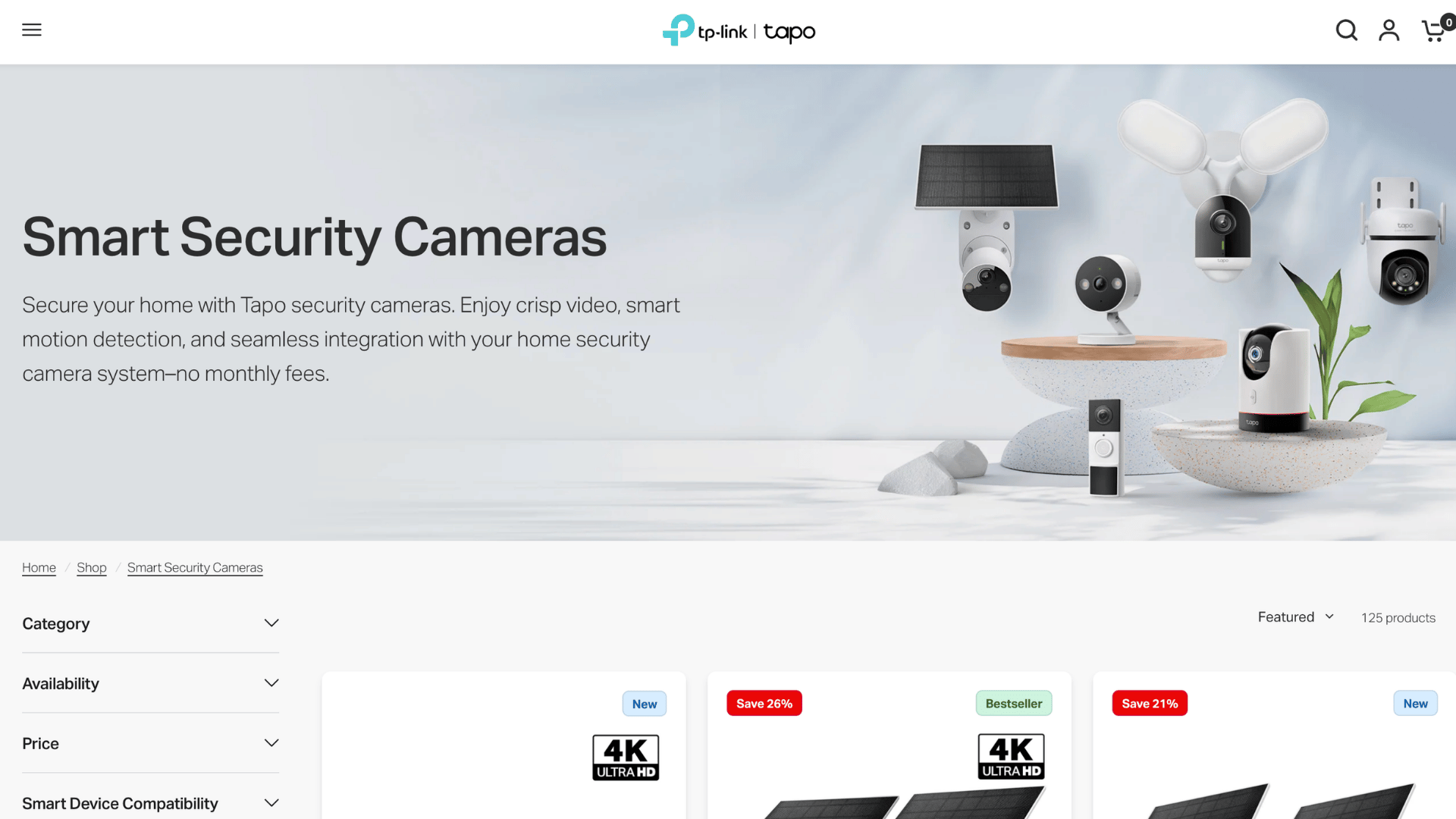 tp link tapo website header showing a selection of smart security cameras on decorative platforms