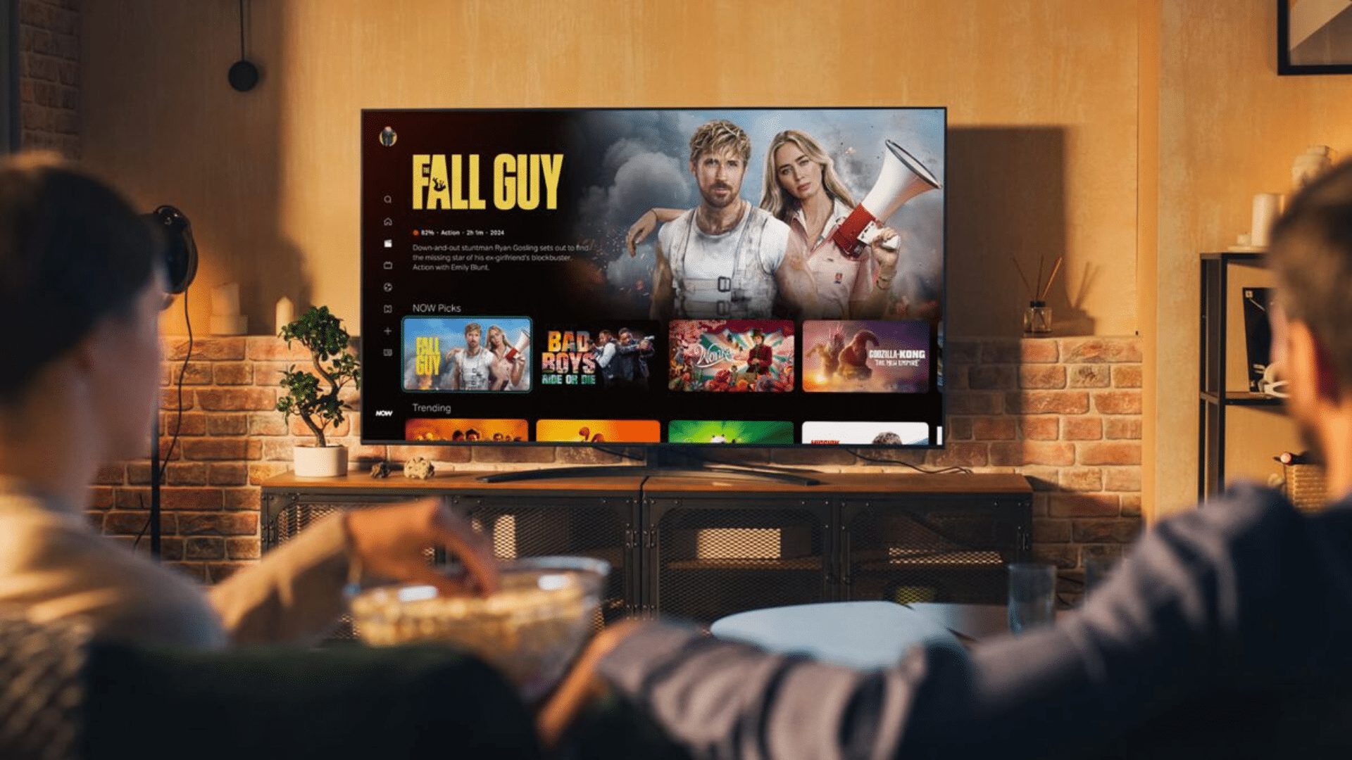using a remote to browse streaming apps on a smart tv home entertainment screen