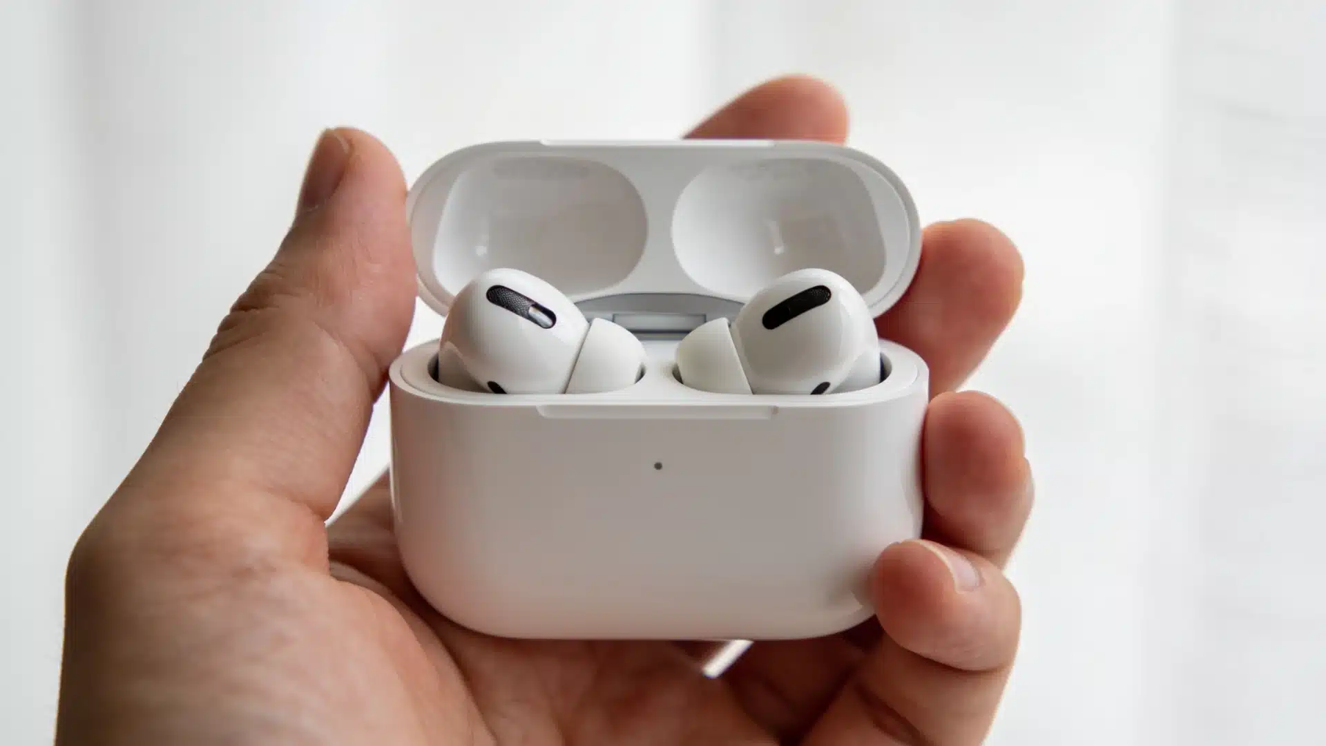 AirPods Pro3 earbuds resting inside an open charging case