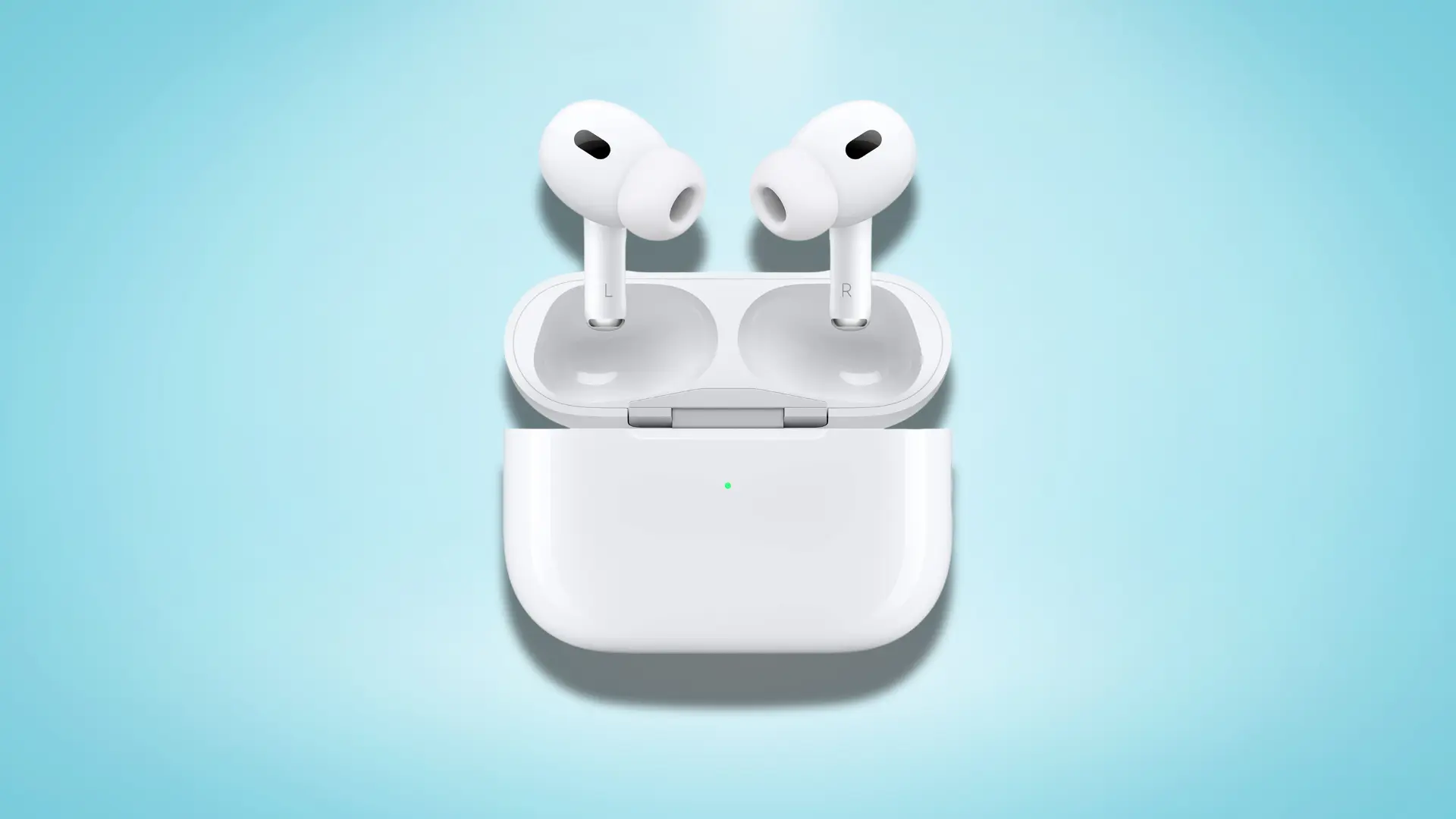 AirPods Pro in an open charging case with green charging indicator