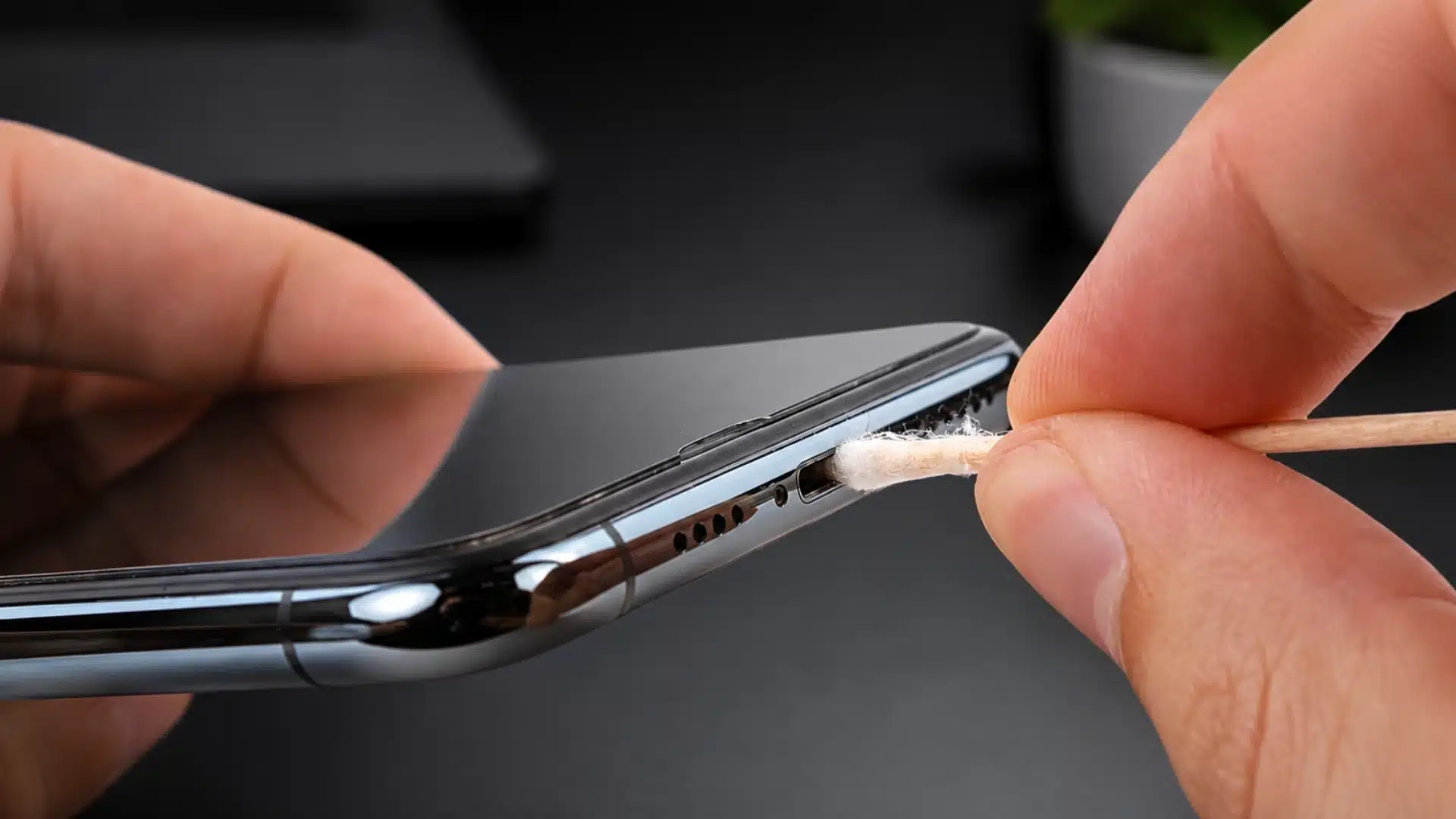 Cleaning smartphone port close-up