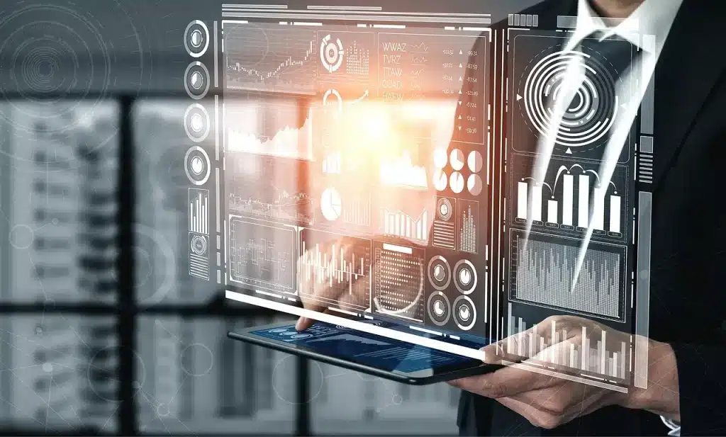 Man in suit interacting with digital data dashboard on tablet, displaying charts and graphs