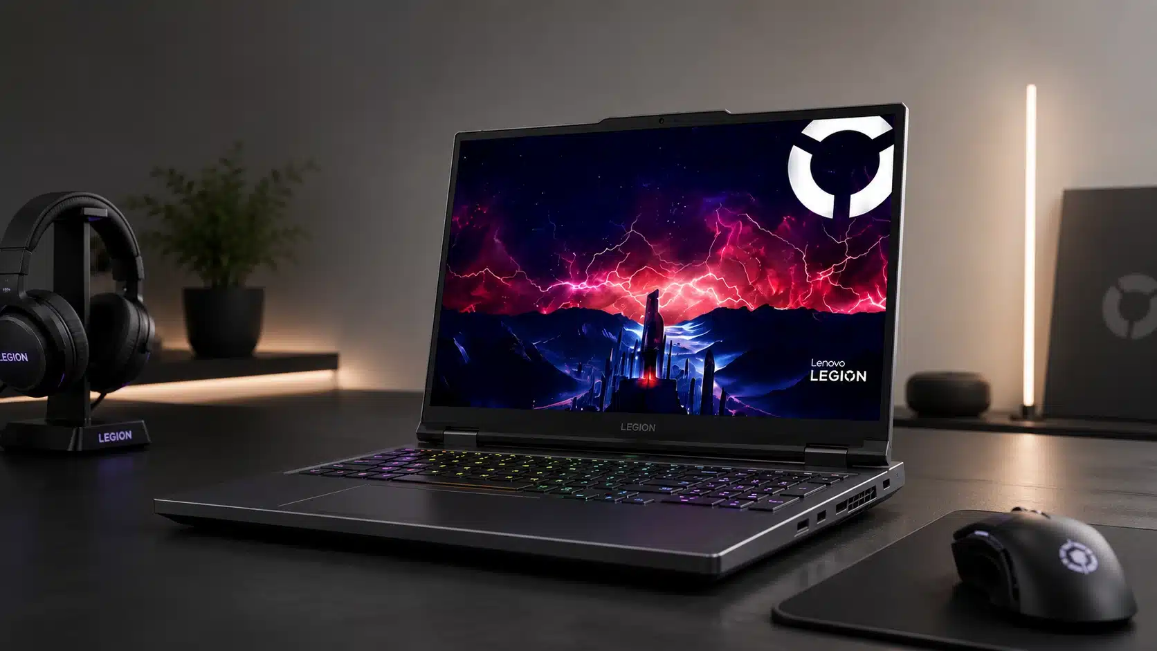 lenovo legion series gaming laptop with a colorful keyboard headphones and mouse on a modern desk