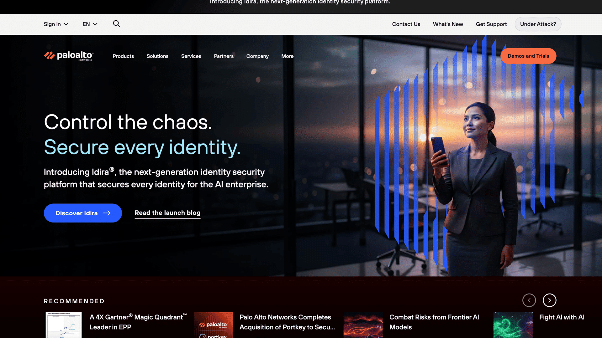 palo alto networks homepage promoting identity security with a business woman holding a phone in an office
