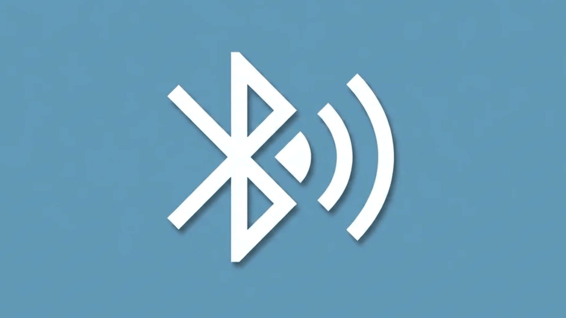 white bluetooth symbol with wireless signal waves centered on a blue background representing wireless connectivity