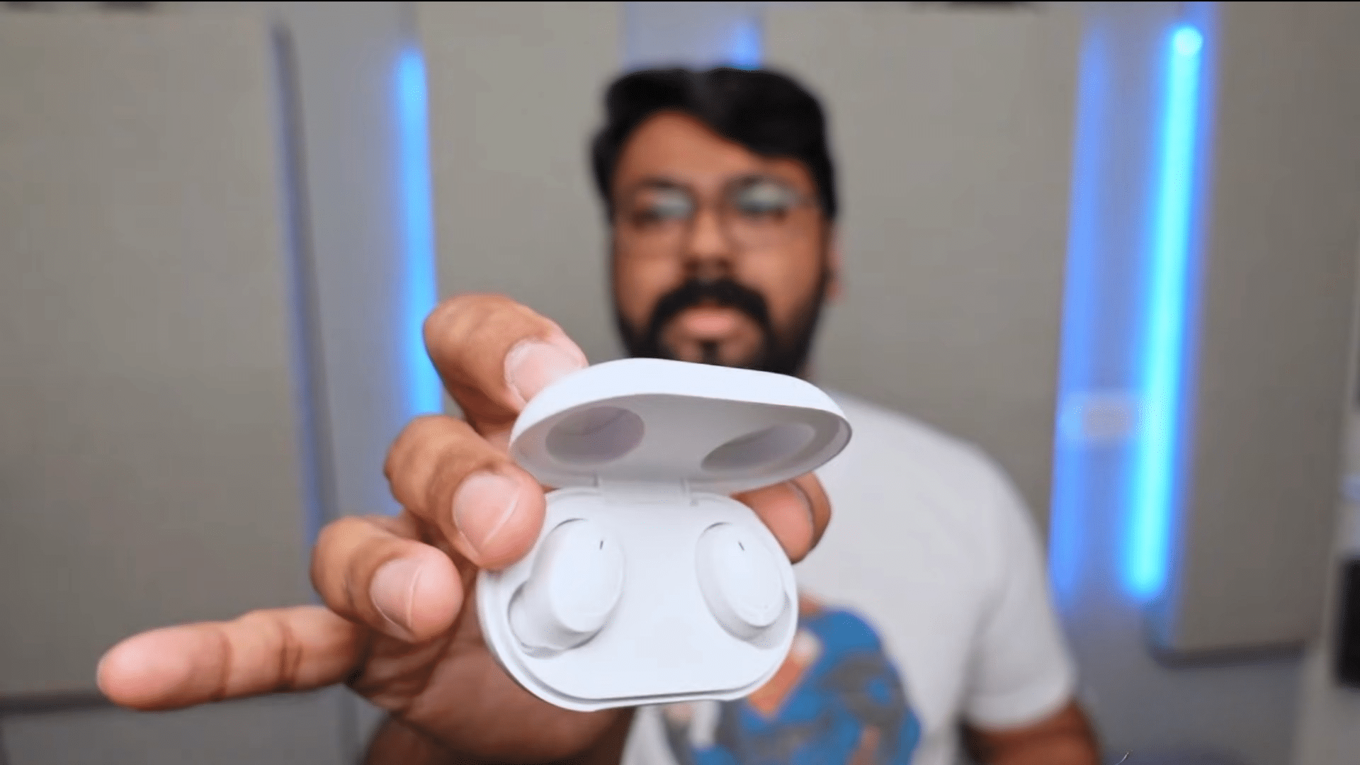 wireless earbuds inside an open charging case ready to enter bluetooth reset and pairing mode (2)