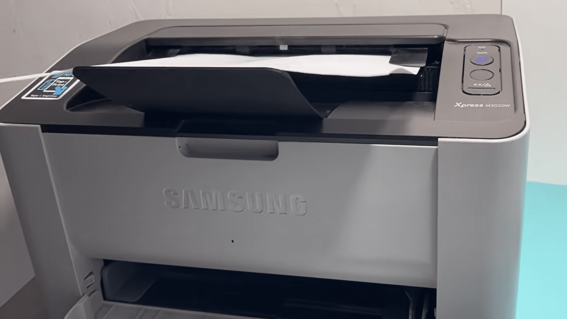 wireless samsung printer printing a document with paper feeding through the output tray during an active print job