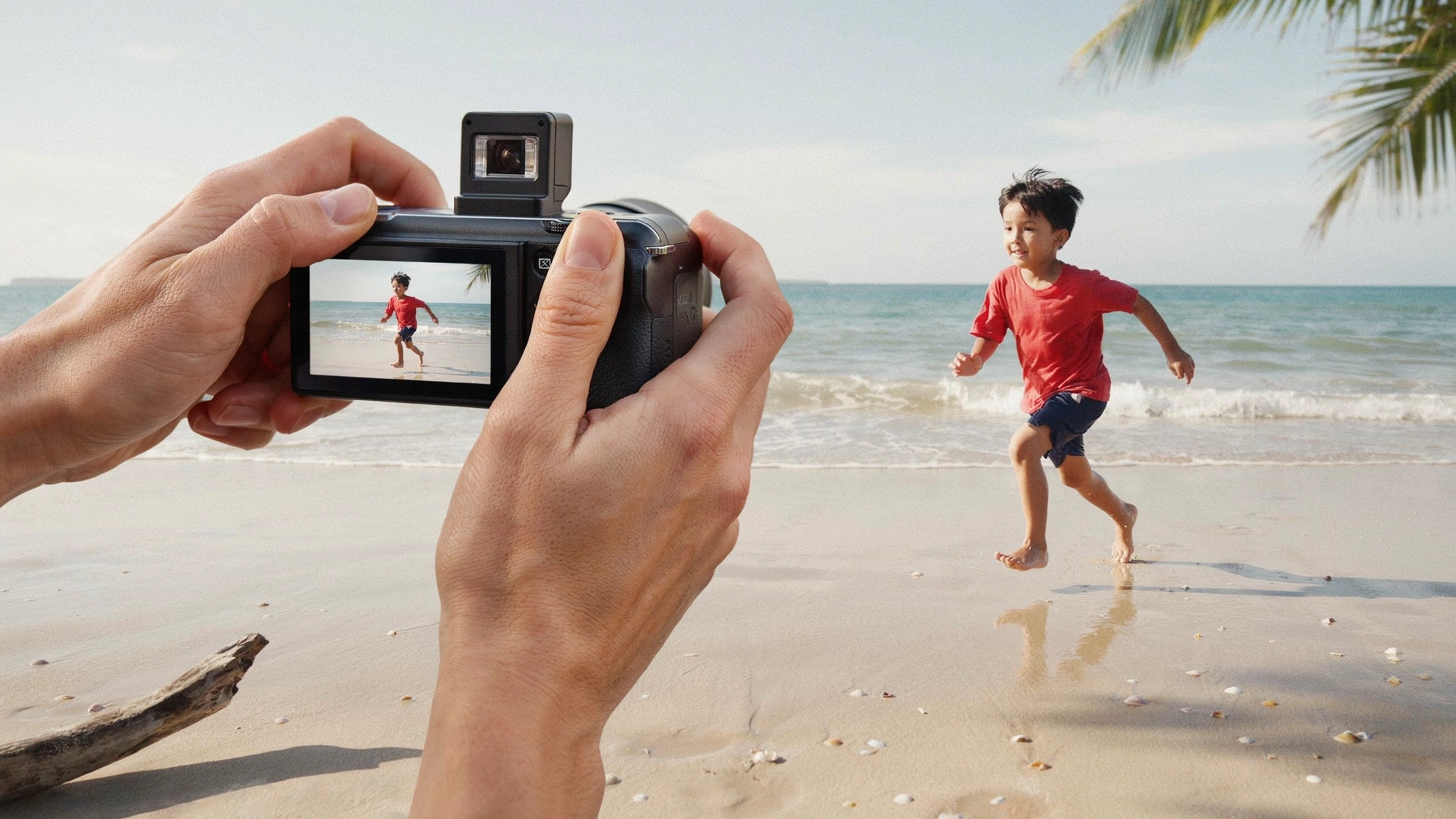 compact camera capturing a child running on beach showing 4k video and action photography features