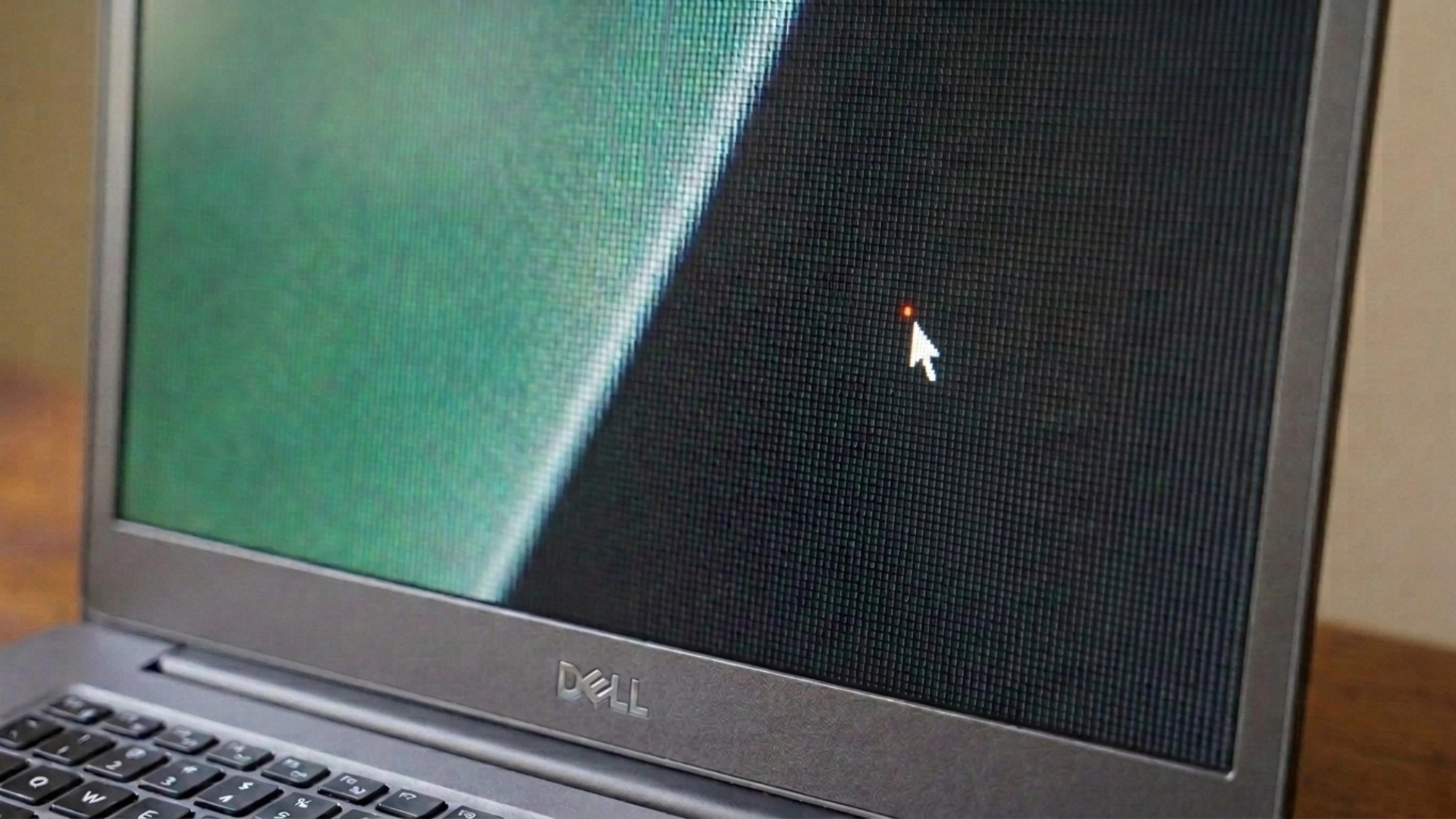 zoomed laptop screen showing pixel grid and highlighted bright defect during display inspection test
