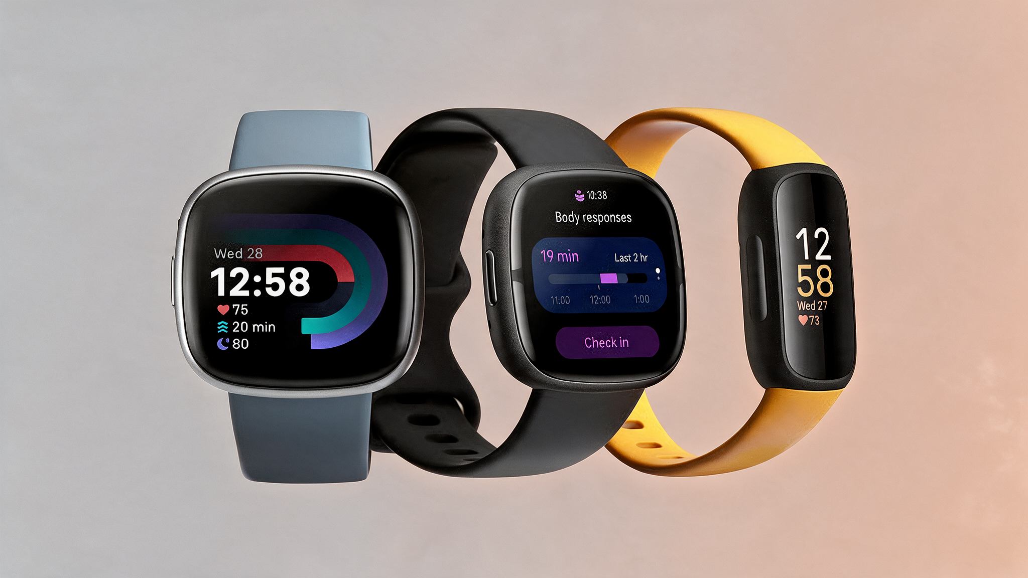 three fitbit smartwatches with blue, black, and yellow bands showing time, heart rate, activity, and body response data