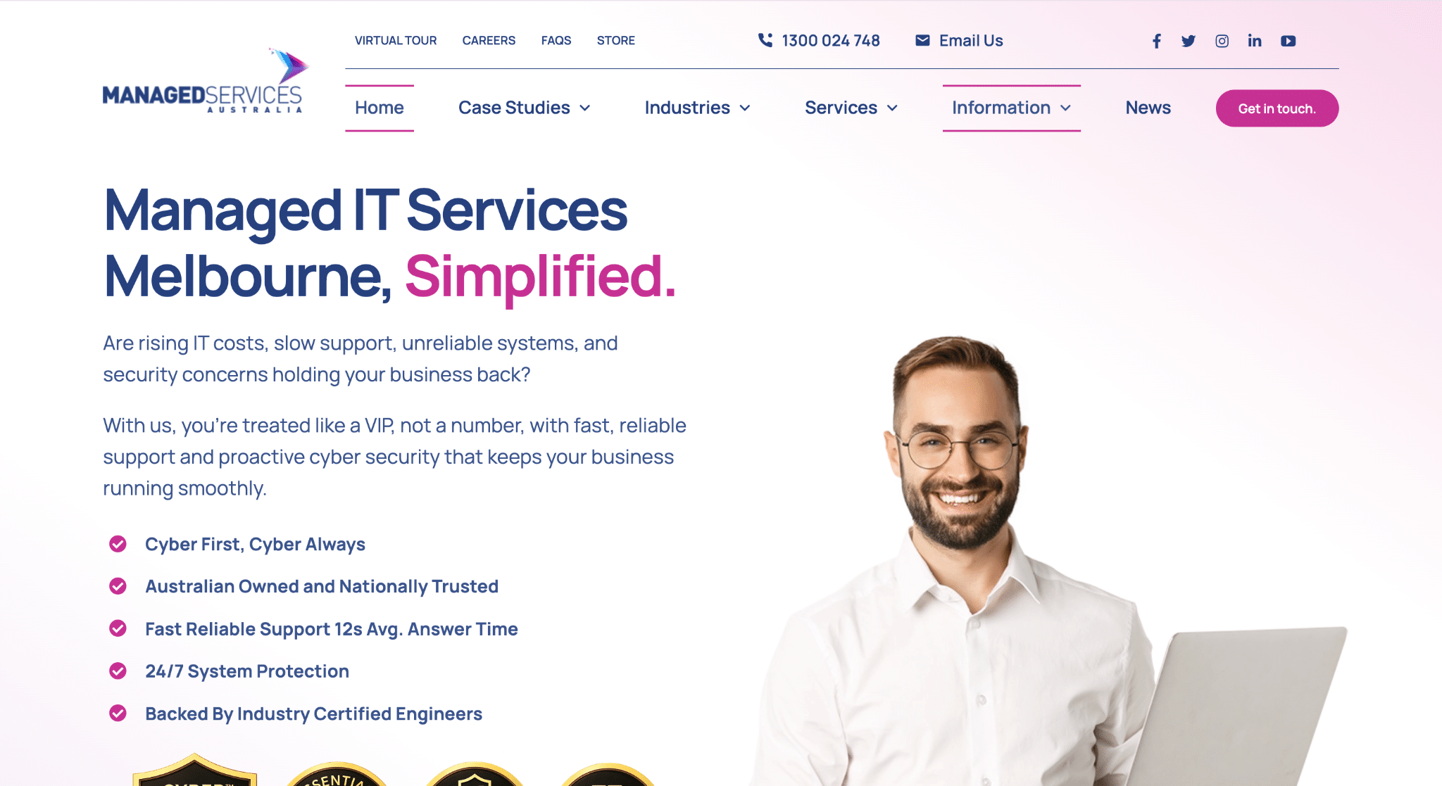 Man holding a laptop on white and pink gradient background with IT services text