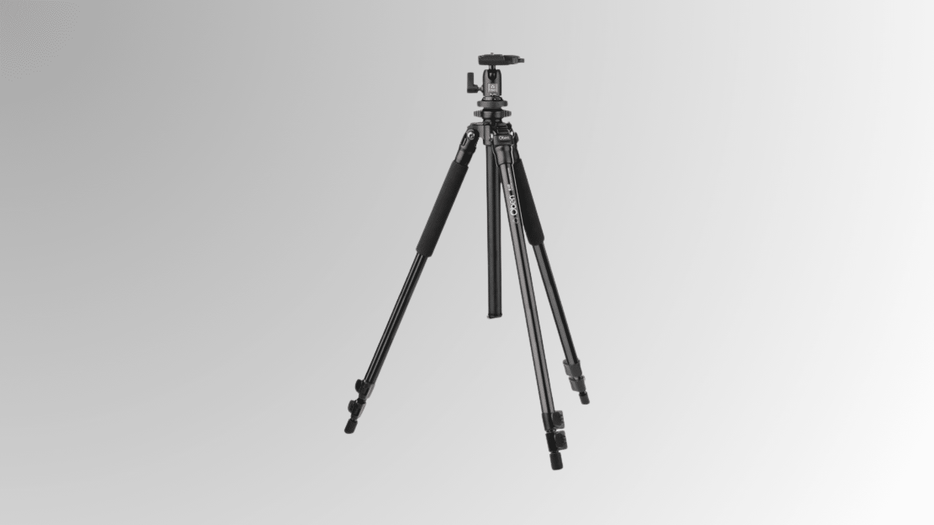 basic black camera tripod standing open with three extended legs on white background