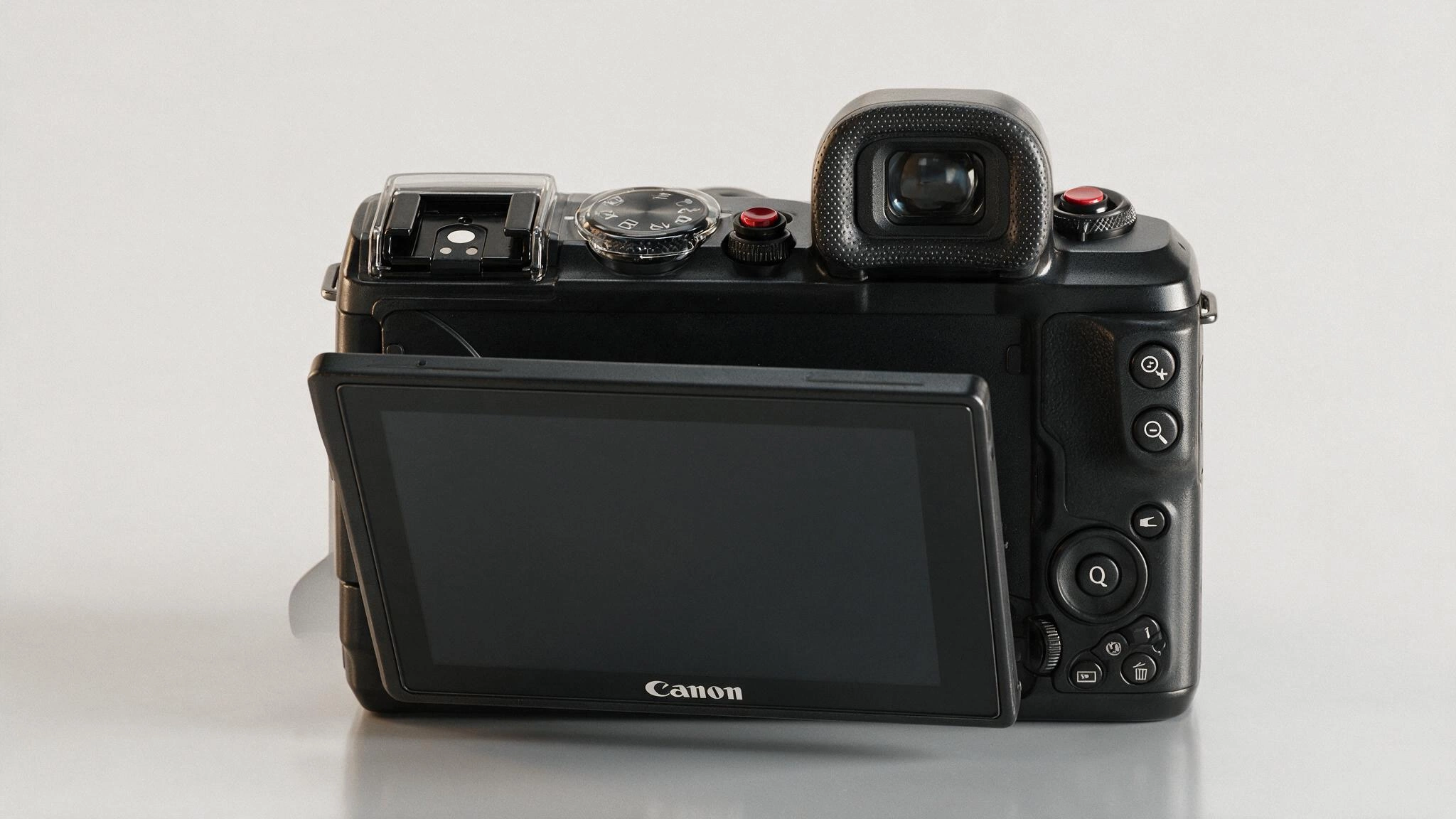rear view of canon eos m50 showing the flip touchscreen control buttons and electronic viewfinder