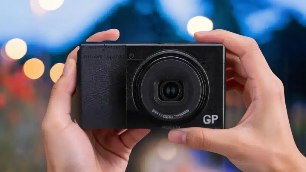 ricoh gr iv compact camera held in hands during outdoor street photography session