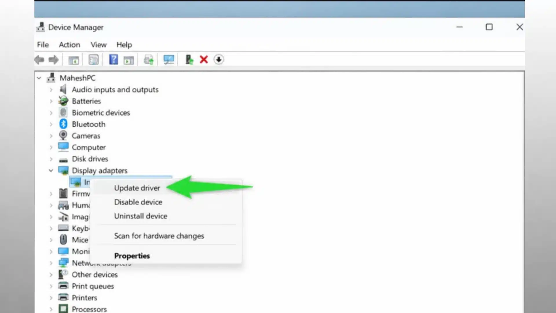 device manager window showing display adapters option with update driver selected for graphics driver update